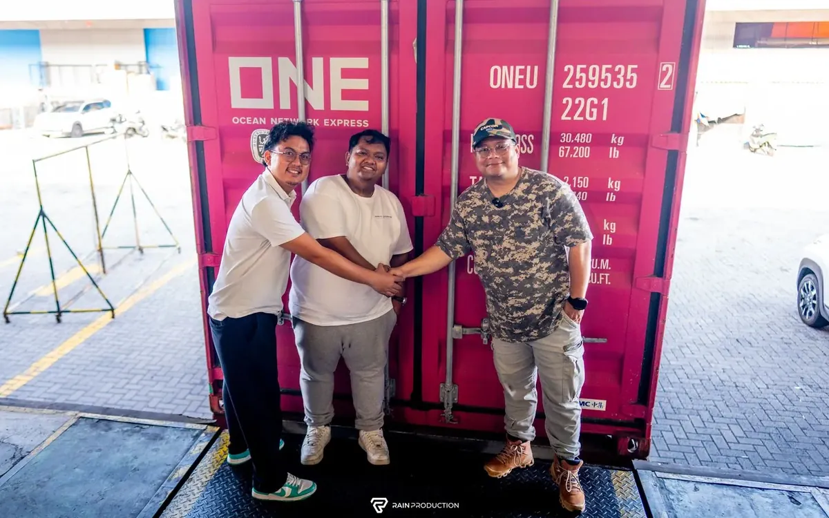 Handover in front of the BMW Passato's shipping container, before SEMA Show 2026
