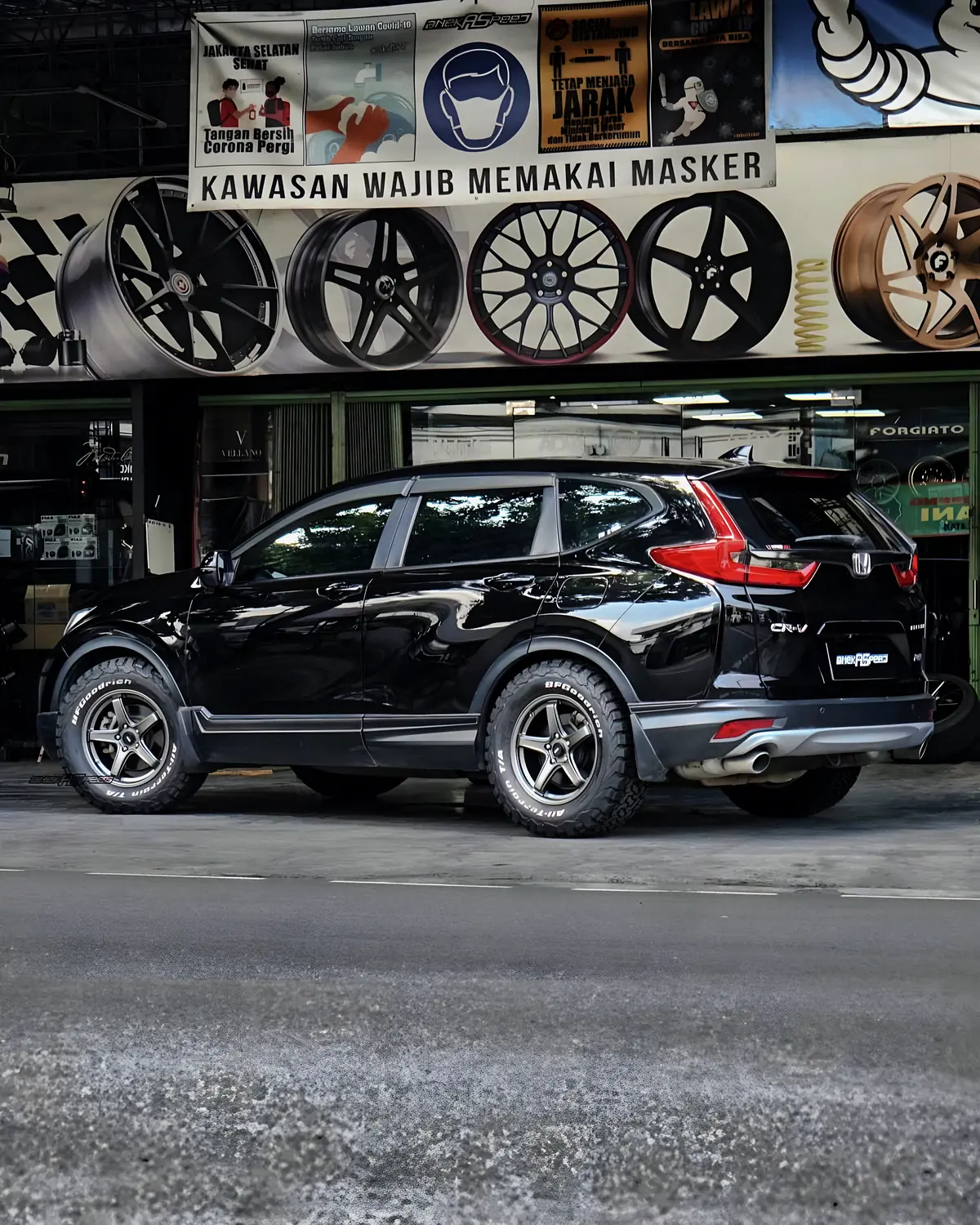 Black Honda CR-V on all-terrain wheels