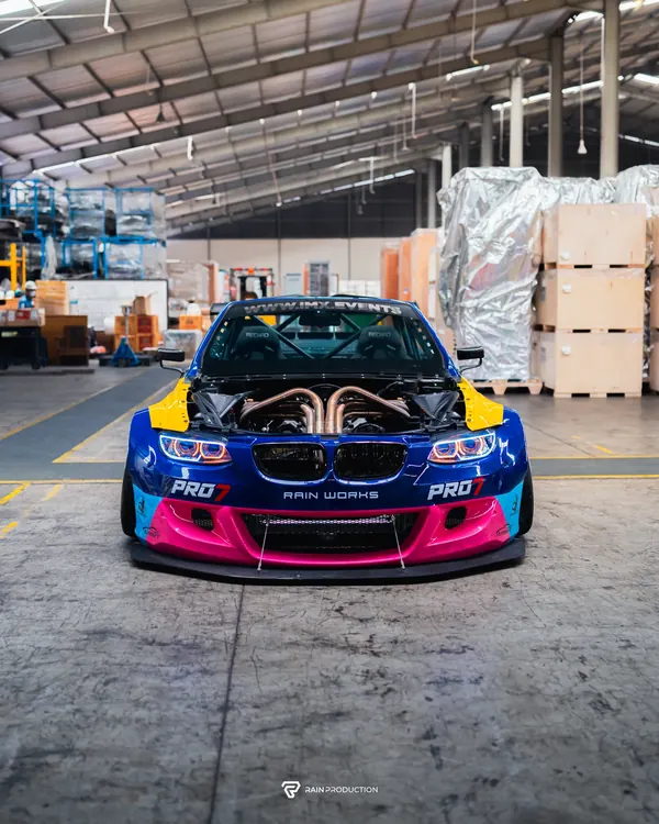 BMW Passato head-on, hood open, in the warehouse