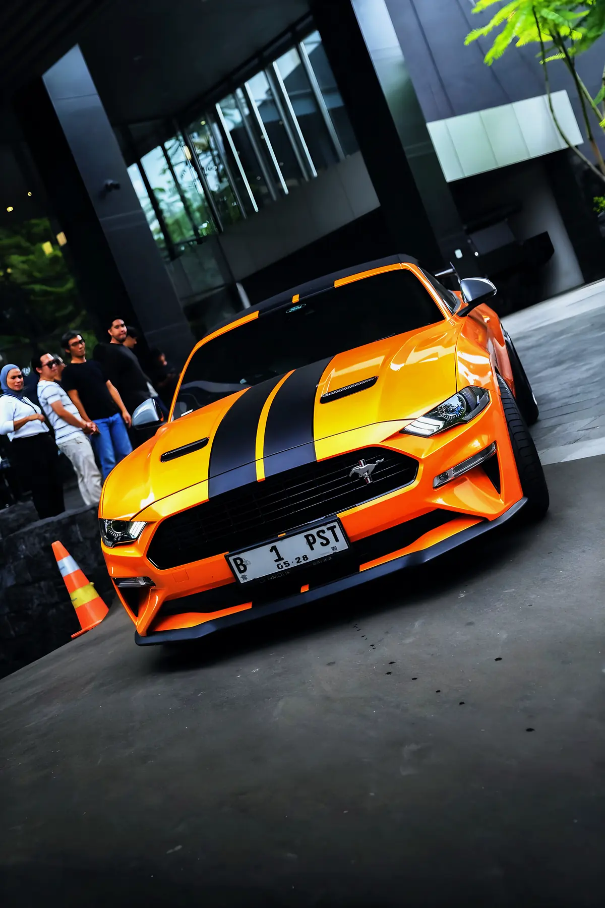 Orange Ford Mustang with black stripes