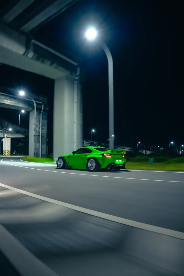 GR86 widebody under the overpass lights at night