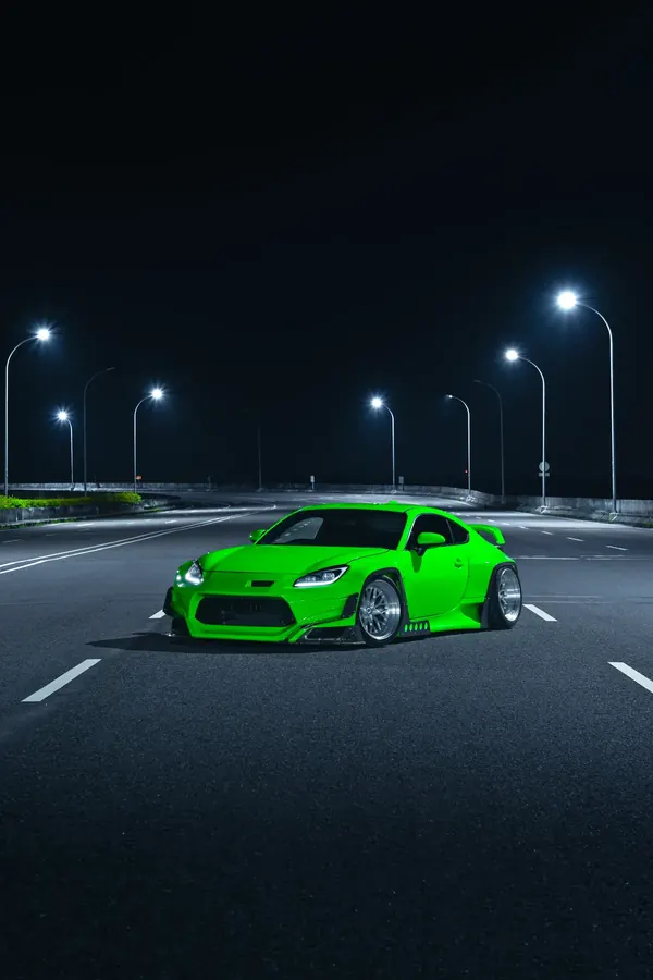 GR86 widebody under street lights at night