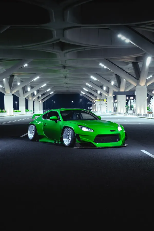 GR86 widebody under a lit canopy at night