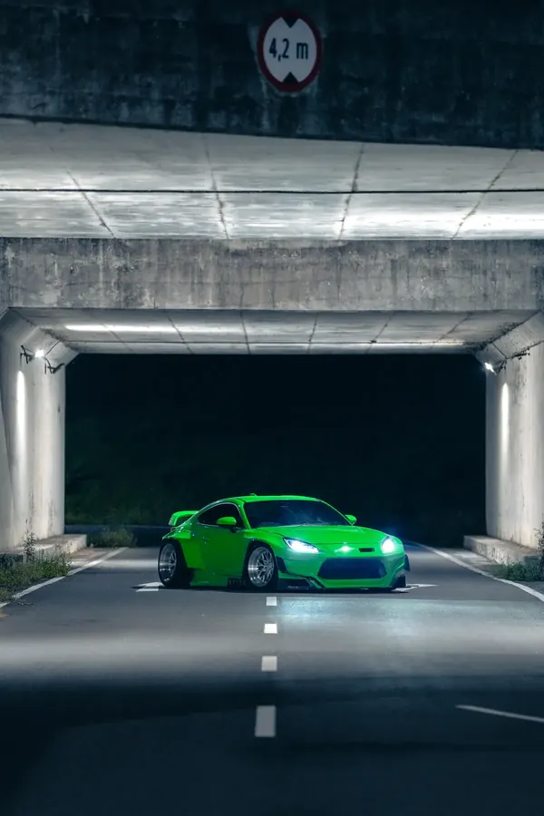 GR86 widebody in a lit underpass at night