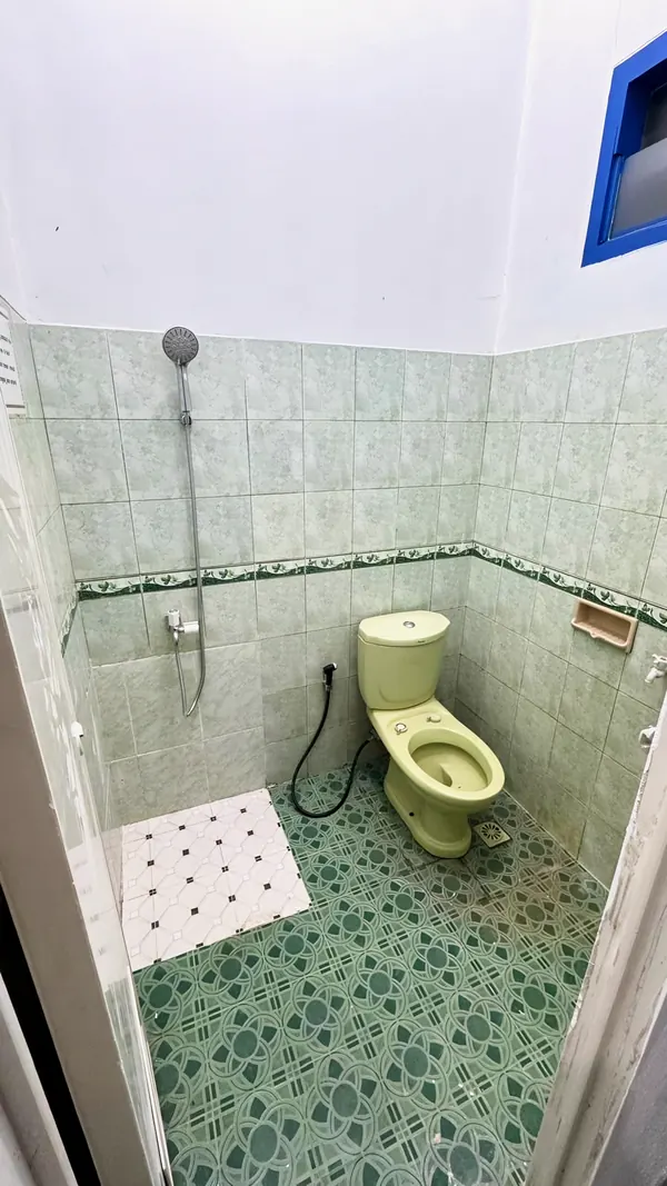 Private bathroom with a shower and a sitting toilet