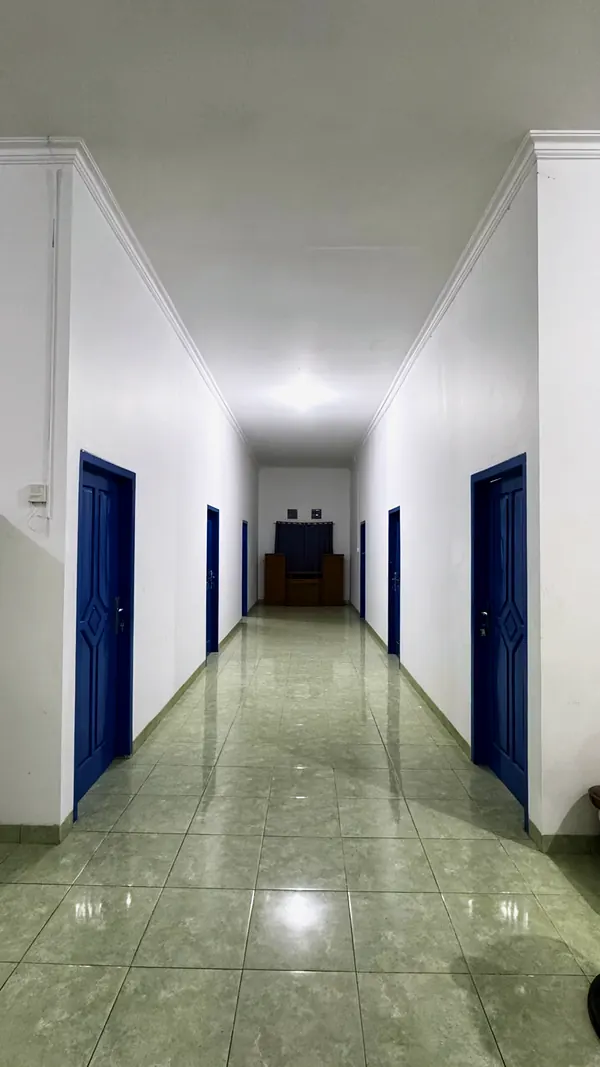 The corridor with blue room doors