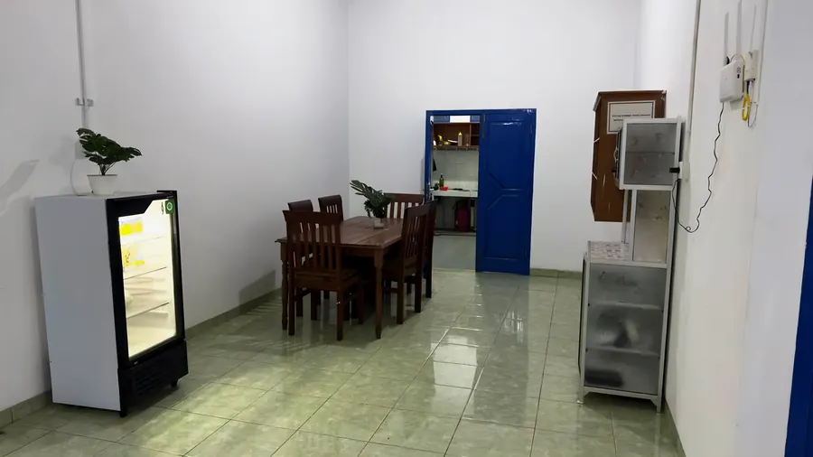 The shared dining table and fridge