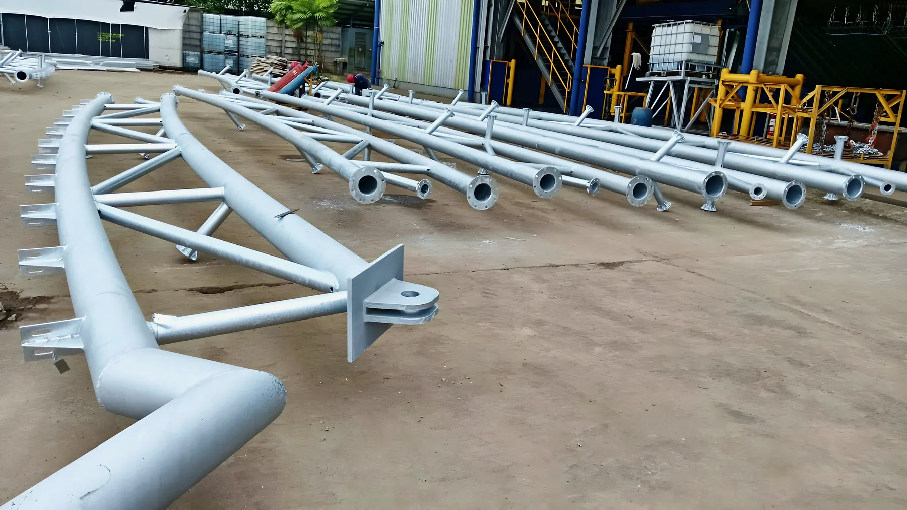 Curved steel trusses laid out in the yard