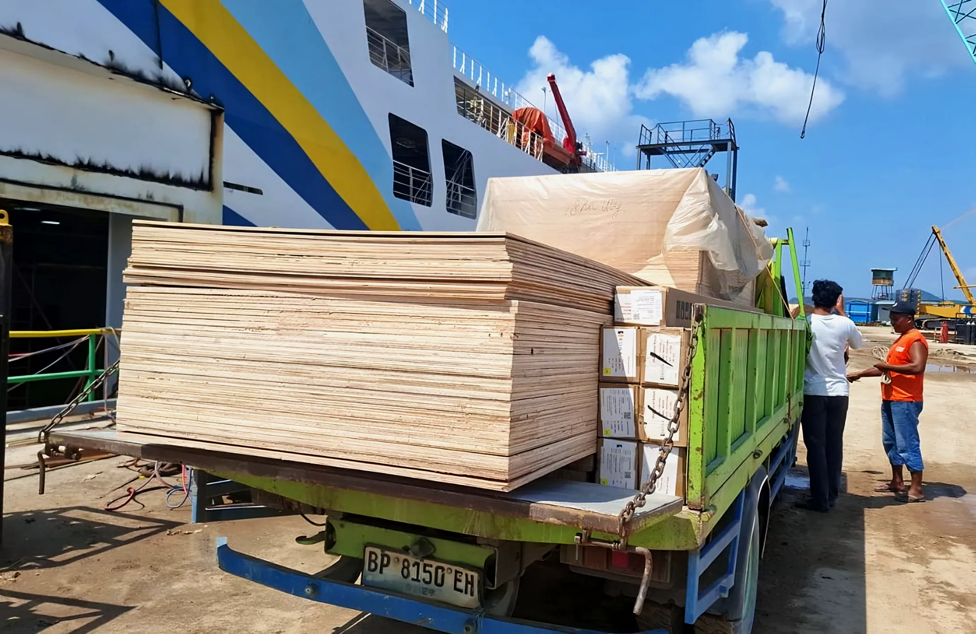 A truck loaded with timber cargo at the port