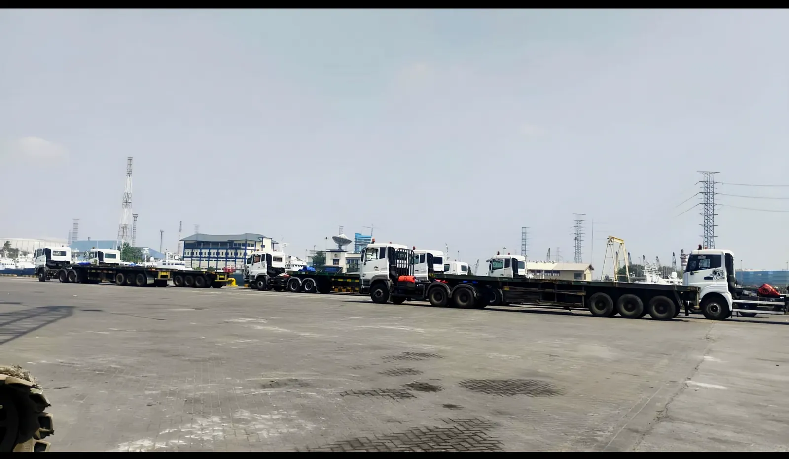 Trailer trucks lined up at the port