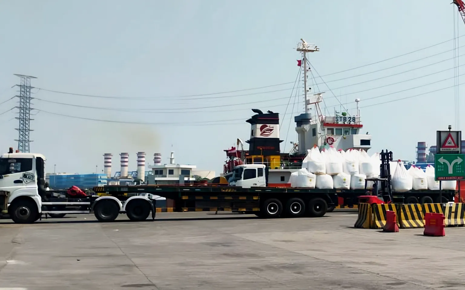 Trailer trucks and bulk bags at the port